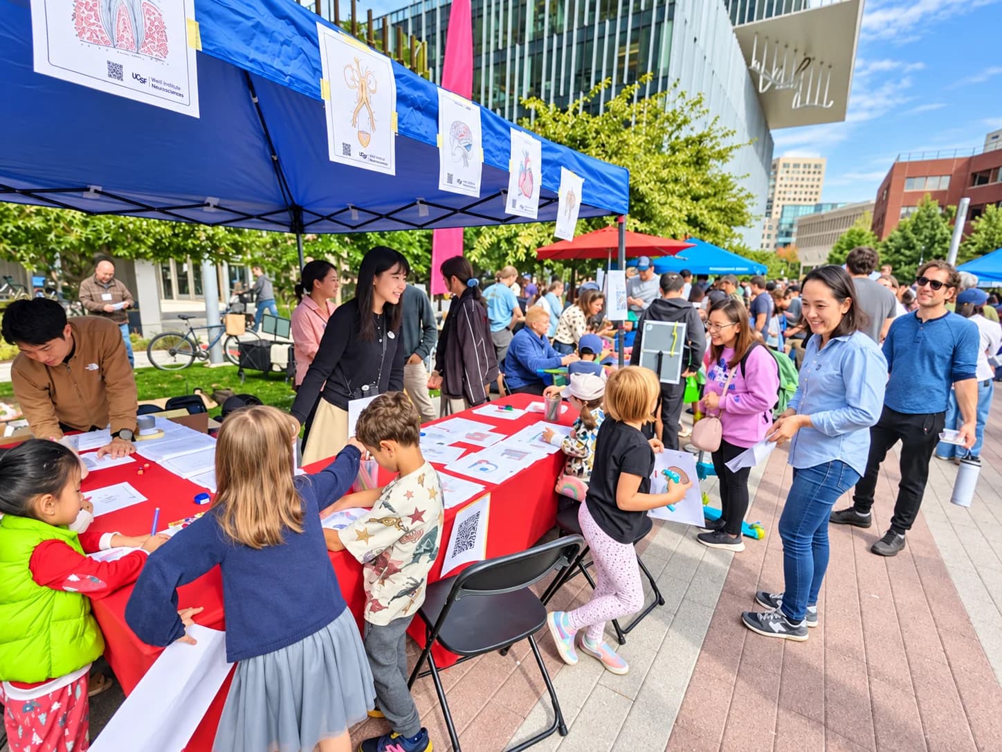 Families and children exploring outdoor science activity tables