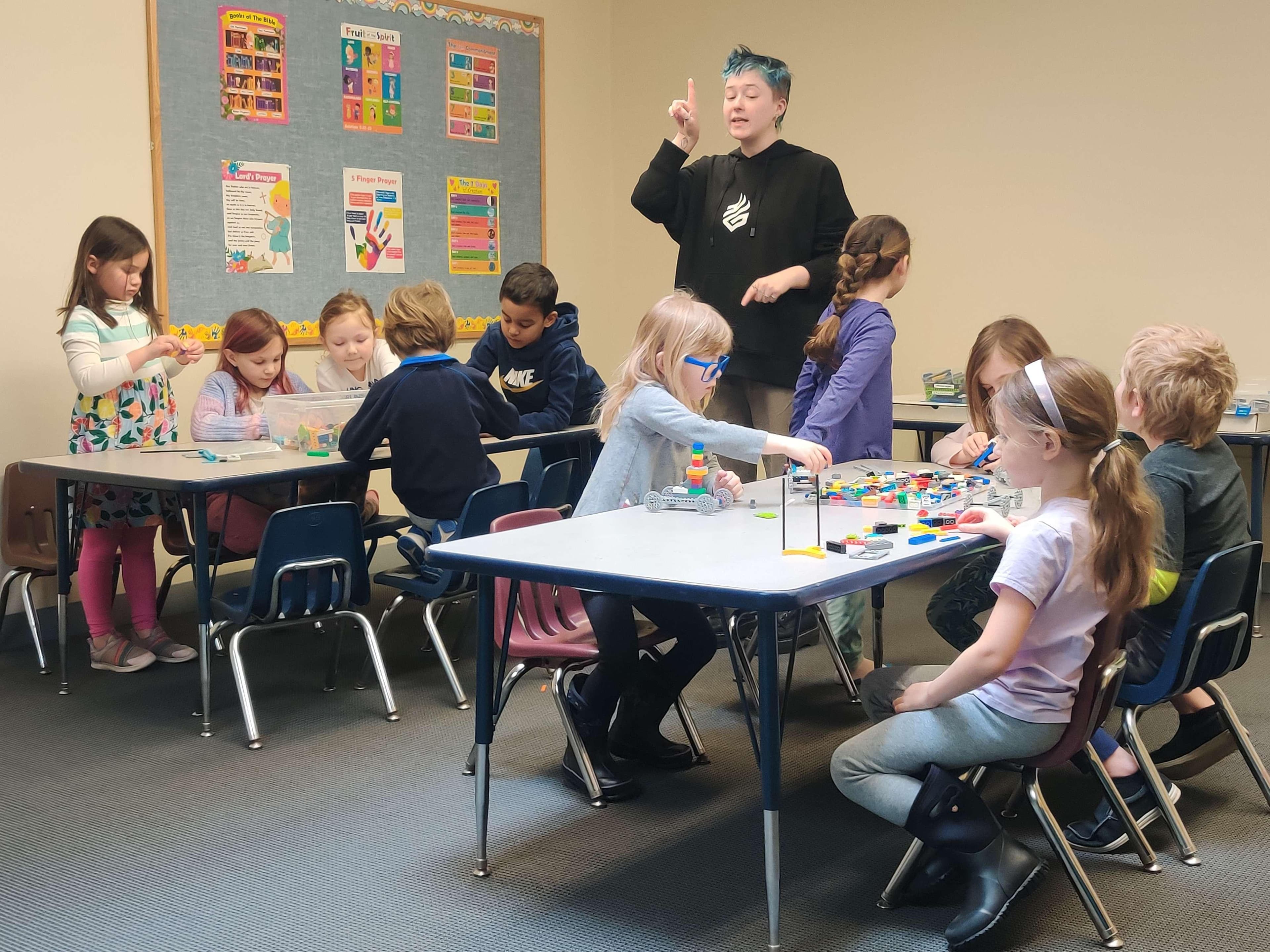 Guild Hall instructor guiding young learners through a building workshop